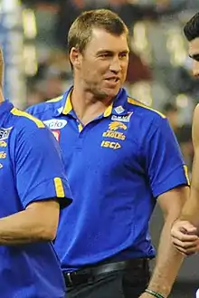 Male football coach on an Australian rules football field