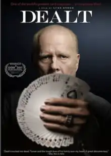 cover of the DVD which shows Turner holding a fanned group of cards in front of him