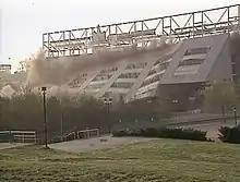 Building being demolished from explosives.