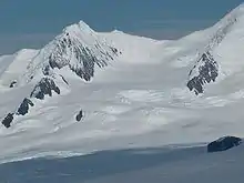 Helmet Peak and Devnya Valley from Zemen Knoll, with Vitosha Saddle in the background and Zlatograd Rock in the right foreground