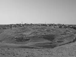 Ancient Dhiban with modern settlement in the background, looking south