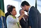 Felipe of Spain, then Prince of Asturias, kisses the hand of President Rousseff.