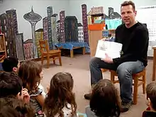 Roff reads one of his books to a classroom at a West Seattle school, March 2008