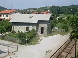 Draga, railway halt. In the background, Prophet Daniel Parish Church in Dornberk.