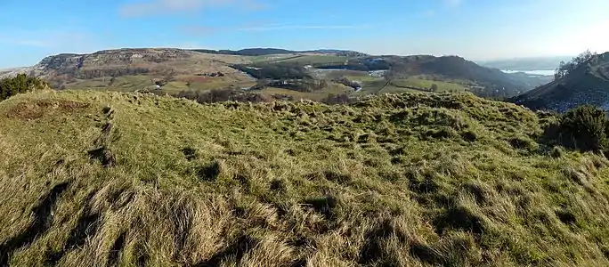 The flat area on the summit was the site of Dumbuie Dun, an Iron Age fort, the antiquity marked on the map.