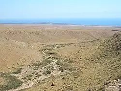 In the desert above Tamchy. Choktal peninsula in the background.