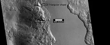 Close view from a previous image, as seen by HiRISE under HiWish program  The triangular shape of some depressions are noted.  The area in the box is enlarged in following images.