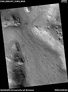 Lineated valley fill in valley, as seen by HiRISE under HiWish program Linear valley flow is ice covered by debris.  Location is Ismenius Lacus quadrangle.