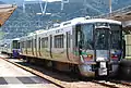 An Ainokaze Toyama Railway 521 series EMU and an Echigo Tokimeki Railway ET122 diesel unit at Tomari Station in June 2015