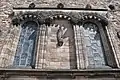 The western façade with 'Freedom' by Percy Portsmouth and niche capitals Phyllis Bone