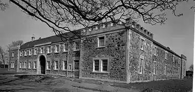 The old estate offices and stables prior to the factory's construction.