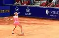 Dementieva hitting a backhand.