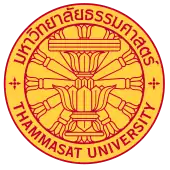 The seal of Thammasat University in Thailand consisting of a Constitution on phan with a twelve-spoked dhammacakka