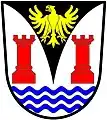 a pile embowed - Argent, on a pile embowed sable, between two towers gules and in base three barrulets wavy azure, an eagle displayed or - West Coast Peninsula Transitional Council, RSA