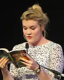 Emereld Fennell reading from a book in 2013.