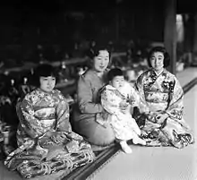 Empress Kōjun holds Princess Takako during the festivities for the Girls' Day, c. 1940