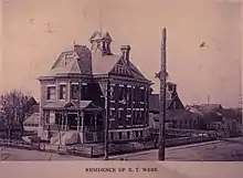 This photo reflects the home in its original setting with barn, carriage house, and green house.