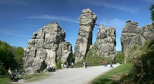 Image 9ExternsteinePhoto credit: Daniel SchwenThe Externsteine, a distinctive rock formation located in the Teutoburger Wald region of northwestern Germany, are a popular tourist attraction. Stairs and a small bridge connecting two of the rocks lead to the top.