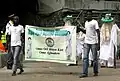 The banner of the Eyo Iga Taiwo Olowo entering the TBS.