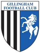 A shield with the words "Gillingham Football Club" in the top portion and the remainder divided into two sections, the left containing black and white vertical stripes and the right a depiction of a white horse rearing up on its hind legs on a blue background