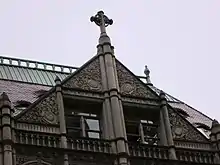 A gable with a window at the top of the building's facade