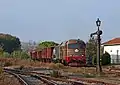 Heritage diesel locomotive approaching the station with a photography charter service.