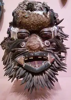 A Wee face mask designed to look like a leopard. On display at the Indianapolis Museum of Art