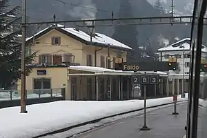 Three-story building with gabled roof