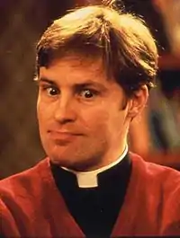 A publicity photograph of Irish actor Ardal O'Hanlon as Father Dougal McGuire