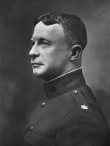 Head and shoulders, left profile; wearing uniform.