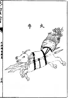 A fire ox - an ox with spears attached to its sides and its tail set on fire