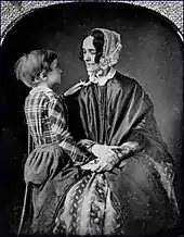 Jane Pierce holds her son Benjamin on her lap