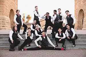 The Stanford Fleet Street Singers at Stanford's Main Quad in 2019, wearing their characteristic outfits