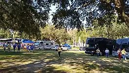 Pregame tailgating, 2019. Note Thomas Hall through the trees, background center