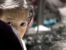 shy young girl at market