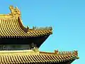 Yellow tiles and figures on the roof the Hall of Supreme Harmony in the Forbidden City