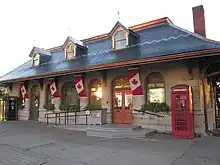 British red phone box alongside standard Bell Canada boxes at former Kingston and Pembroke Railway station