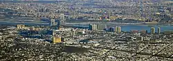 Fort Lee, New Jersey, in the foreground, connected by the George Washington Bridge to Upper Manhattan, New York City, across the Hudson River, in the background (2014)