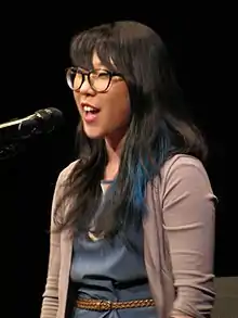 Franny Choi performing at a poetry slam