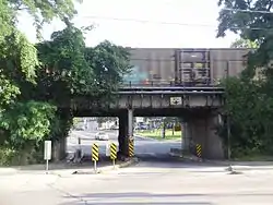 A freight train crossing a railway bridge at the south end of Scarlett Road