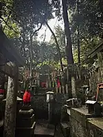 Fox guardian at the Fushimi Inari shrine.