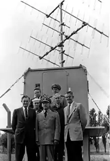 Radio Control Hut and Team Overseas Bottom left to right: Howard O. Lorenzen Countermeasures Branch Head CDR Irving E. Willis Site Executive Officer William Edgar Withrow Radio Control Hut Engineer Middle left to right: PO2 Lee Interrogation Operator PO1 Hilbert R. Hubble Interrogation Operator Top left to right: Reid D. Mayo GRAB Project Officer