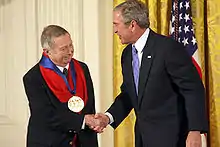 George Tooker receiving the National Medal of Arts from George W. Bush