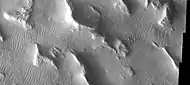 Gigas Sulci, as seen by THEMIS.  Wavy linear ridges are dunes.  Dark slope streaks are visible on some slopes if you click on image for larger view.