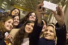 A group of young women pose for a photograph.