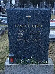 alt=A tombstone with a gold cross. The inscription reads: 
Dirtl Family
Leopold 1890-1948
Fritz 1928-1956
Anna 1895-1969
Leopold W Dirtl 1922-2012