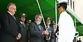 President Lula da Silva and the Minister of Defence Nelson Jobim delivering a sword during a graduation.