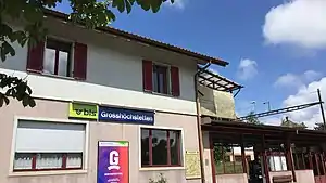 Two-story station building with gabled roof