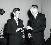 Photo of Huizenga being awarded the Ernest Orlando Lawrence Award bestowed by Glenn T. Seaborg.