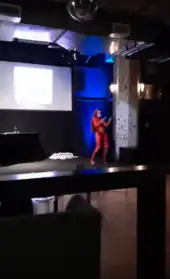 Photo of a drag queen on stage at Headroom